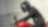Motorcyclist in a black helmet on red motorbike